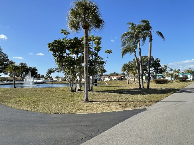 View of a park with a pond and a fountain in Ranchero Village